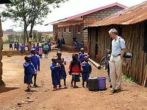 A group of children from Garissa Road primary school gather to talk to Rotarian Bruce Gow