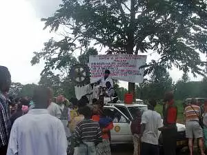 A Rotary truck sets up a temporary stall under a tree to sell mosquito nets in Arusha