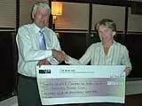 Rotarian Diane Clarke presents a cheque for £2000 to Carl Undery of the Thames Valley and Chiltern Air Ambulance Trust