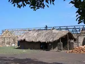 With the brick work largely finished, workers begin constructing the roof on new classrooms at Kakenzie school