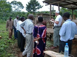 Rotarian Andrew Bartholomew talking to a group of villagers in Mubende