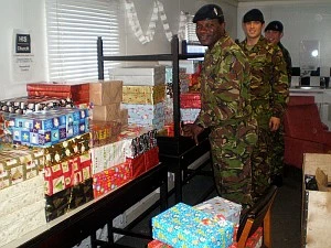 Soldiers collecting shoeboxes