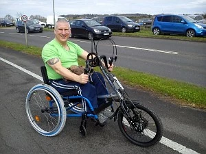 Trevor Bailey shows off his new hand cycle