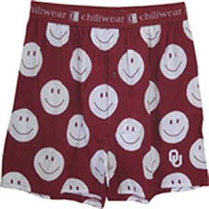 A red pair of pants with smiley faces on