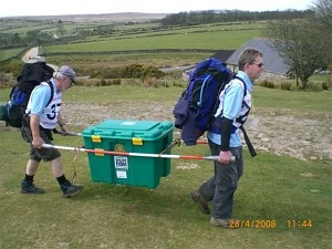 Two members of the Abingdon Vesper team carrying a ShelterBox